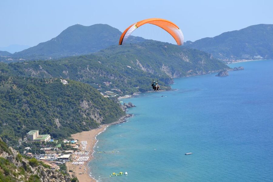 Corfu: Paragliding Tandem Flight Above Pelekas Town - When the Wind Changes: Paragliding vs Paratrike Motorized Flight