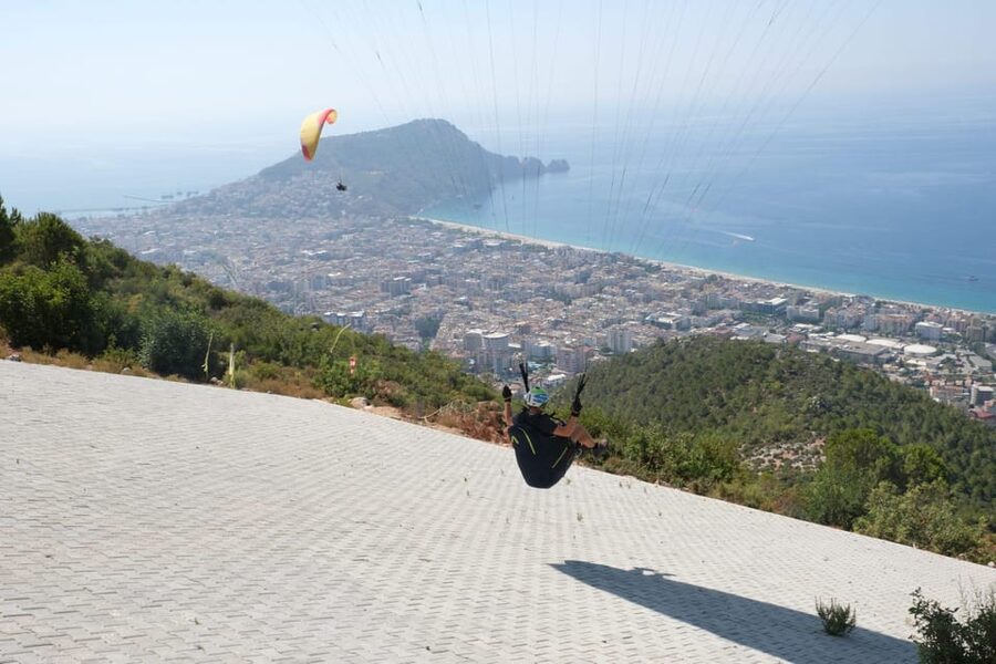 From Antalya, Belek, Side Alanya Paragliding Experience - Hotel pickup to Cleopatra Beach: how the day actually flows