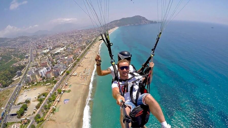 From Antalya, Belek, Side Alanya Paragliding Experience - Landing back at Cleopatra Beach and getting your photos/video