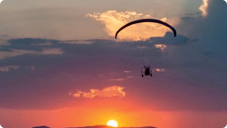 Ibiza: 25min Motorized Paragliding Flight - Sunset route: San Antonio Bay, Cala Bassa, and Cala Compte