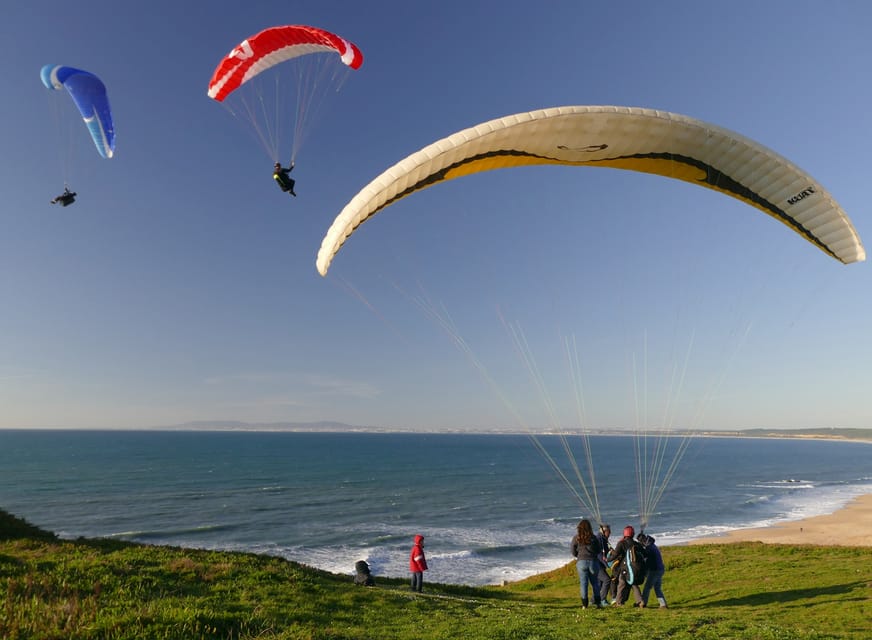 Nazare: Paragliding tandem flight - When conditions are right: thermal lift, cloud-base flying, and possible acrobatics